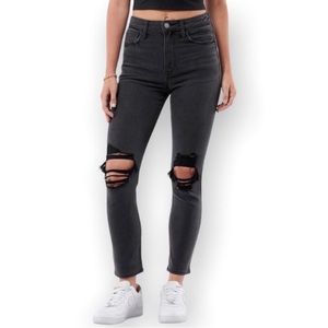 lightly faded black ripped skinny ankle jeans